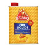 Un bidon jaune orné de motifs d'alvéoles d'abeilles, avec le petit bonhomme en bois O'Cedar qui se détache sur le logo rouge.